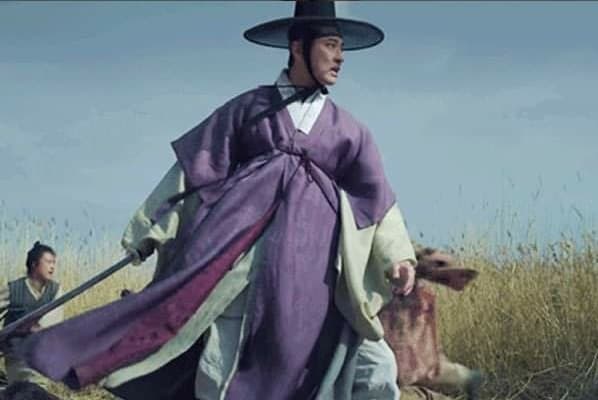 A scene from the drama Kingdom - Hanbok is blowing in the wind.