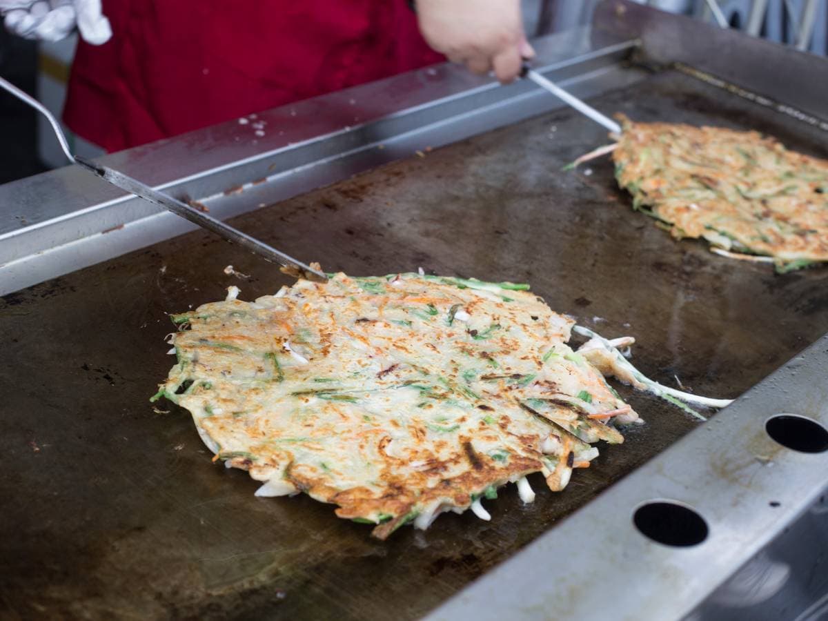 Cooking jeon on a large pan