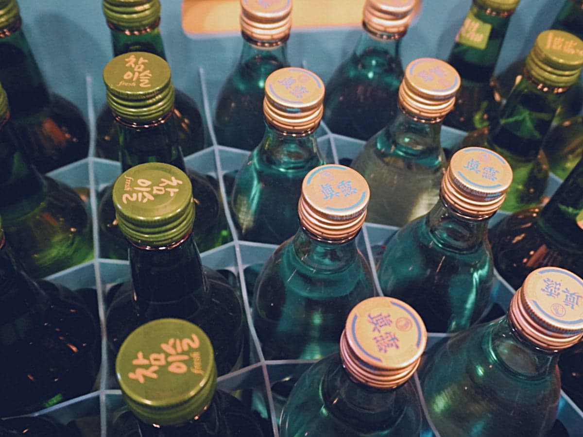 Various brands of soju are full in a crates box