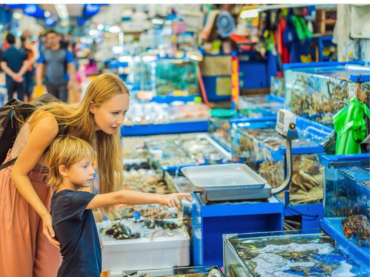 People looking at seafood at Noryangjin Fish Market