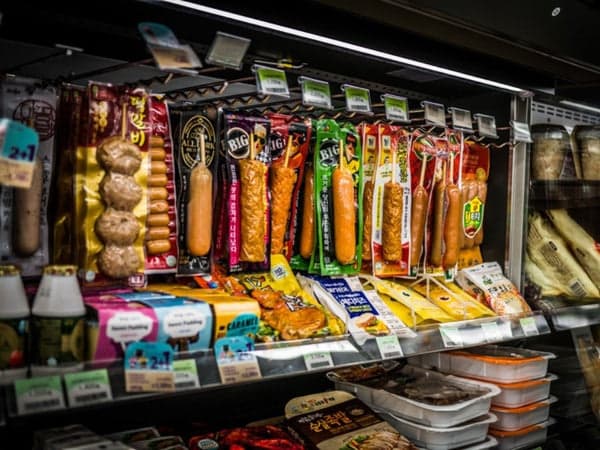 Various sausages on a convenience store stand
